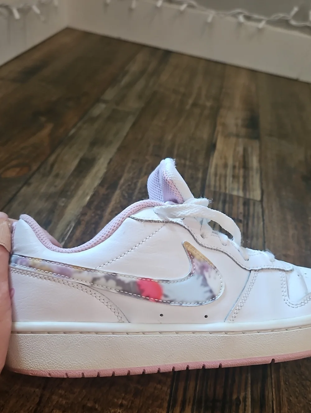 Nike White Low-Top Sneakers with Marbled Swoosh and Pink Details
